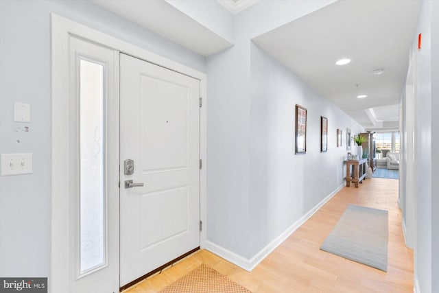 foyer entrance with baseboards, recessed lighting, and light wood-style flooring