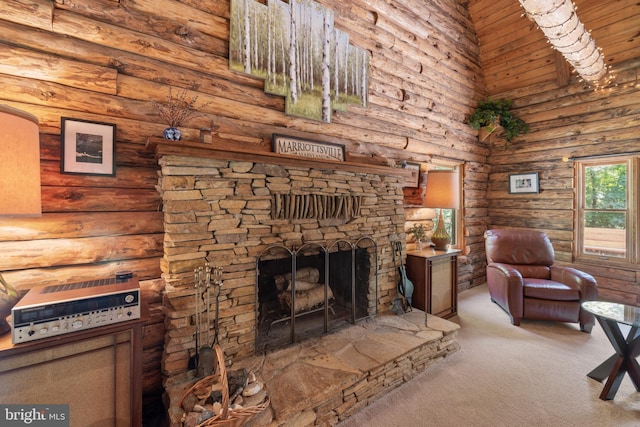carpeted living room with a stone fireplace and log walls