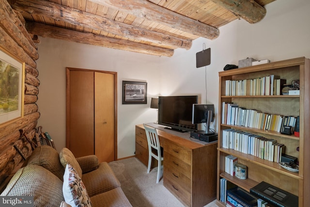 office with carpet, wooden ceiling, rustic walls, and beam ceiling