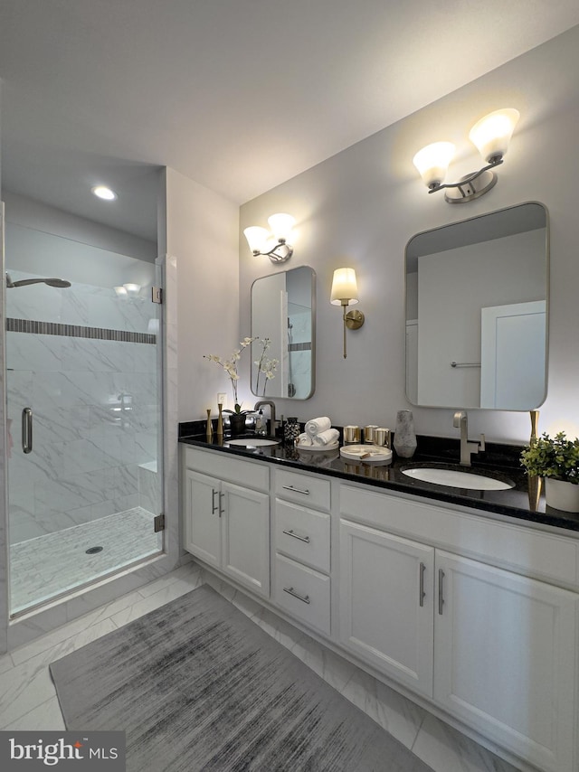 bathroom with recessed lighting, a marble finish shower, a sink, and marble finish floor