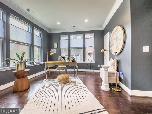office area featuring crown molding, wood finished floors, and visible vents