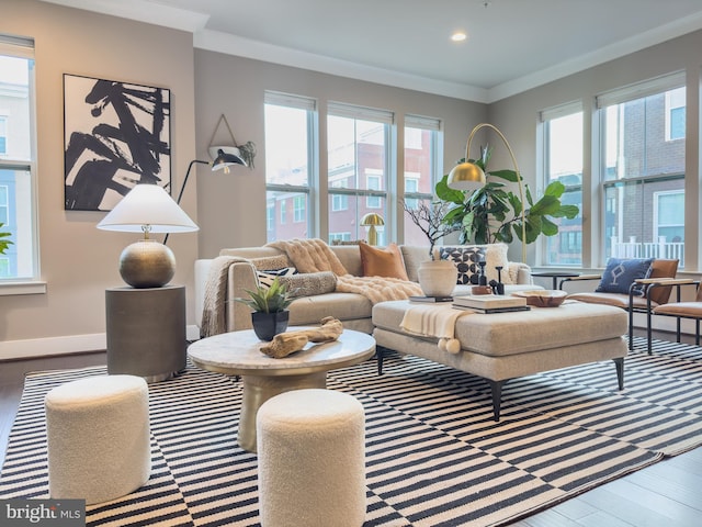 living room with crown molding, baseboards, recessed lighting, and wood finished floors