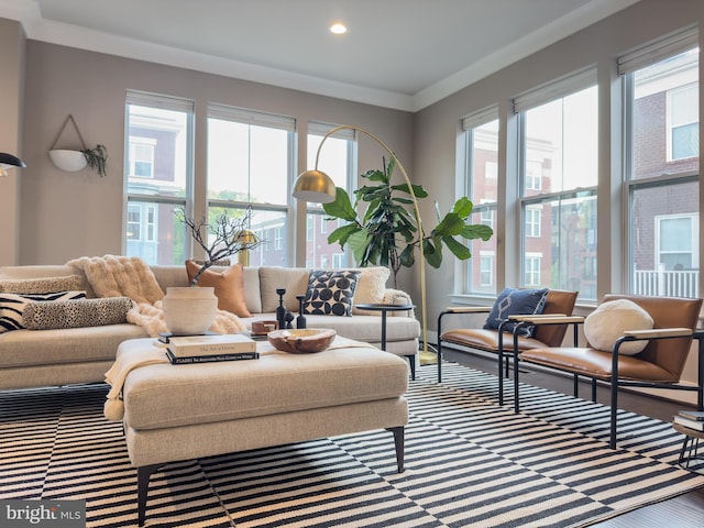 living area with recessed lighting, ornamental molding, and wood finished floors