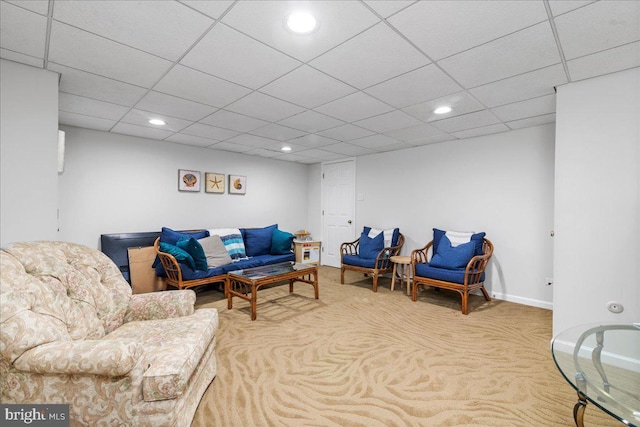 living area featuring carpet floors, a paneled ceiling, recessed lighting, and baseboards