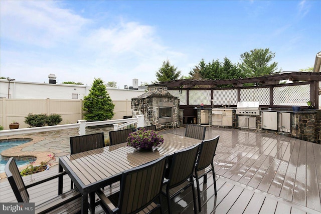 deck featuring area for grilling, an outdoor stone fireplace, fence, outdoor dining area, and a pergola