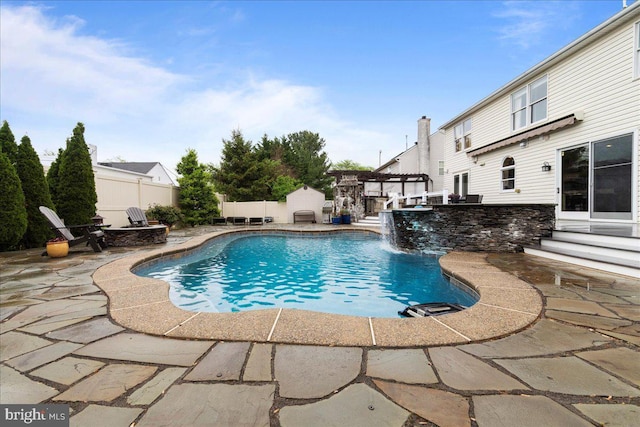 view of swimming pool featuring a patio and fence