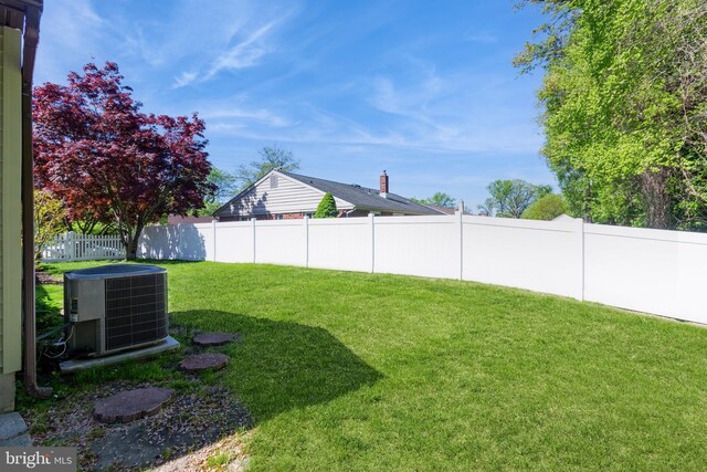 view of yard featuring a fenced backyard and cooling unit