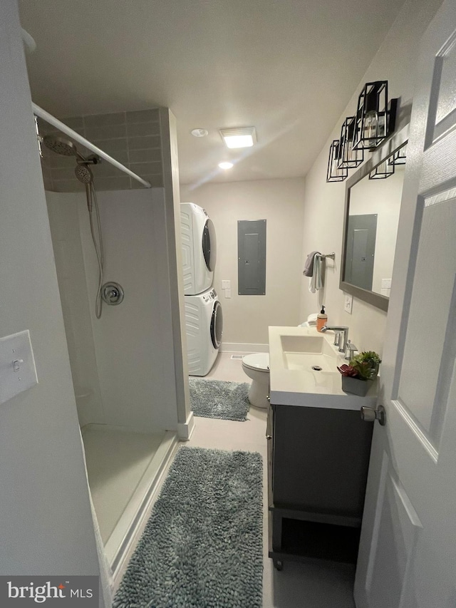 3 Talbot Ave, Cambridge, MD 21613 - bathroom with stacked washing machine and dryer, a shower stall, electric panel, and vanity