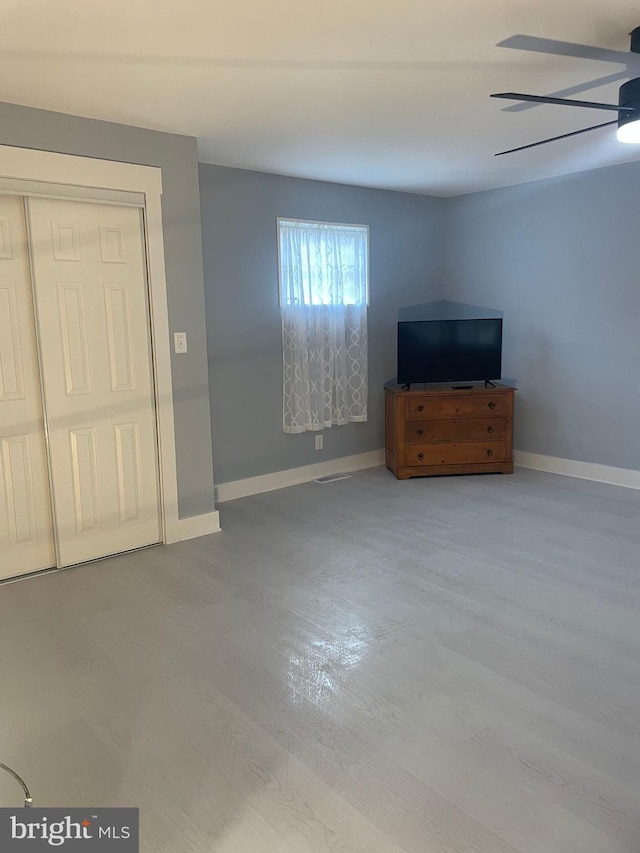 3 Talbot Ave, Cambridge, MD 21613 - unfurnished living room featuring ceiling fan, baseboards, and wood finished floors