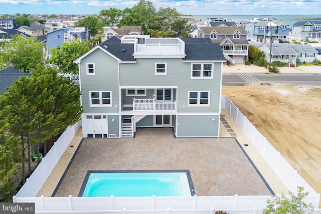 339 11th, Ship Bottom, NJ 08008 - rear view of property featuring a residential view, a fenced backyard, a patio area, and roof with shingles