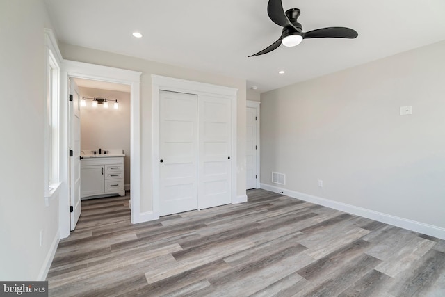 339 11th, Ship Bottom, NJ 08008 - unfurnished bedroom featuring light wood-type flooring, a closet, recessed lighting, baseboards, and ensuite bathroom