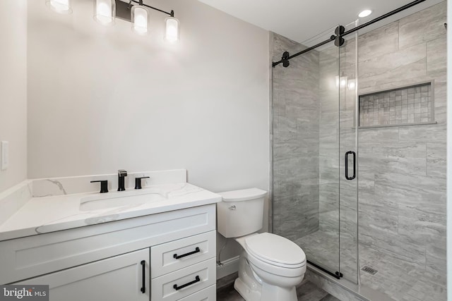 339 11th, Ship Bottom, NJ 08008 - bathroom featuring toilet, vanity, and a stall shower