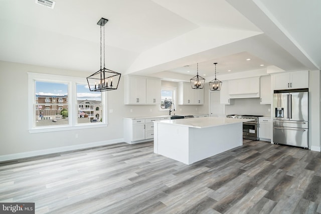 339 11th, Ship Bottom, NJ 08008 - kitchen with stainless steel appliances, a chandelier, a sink, white cabinetry, and recessed lighting