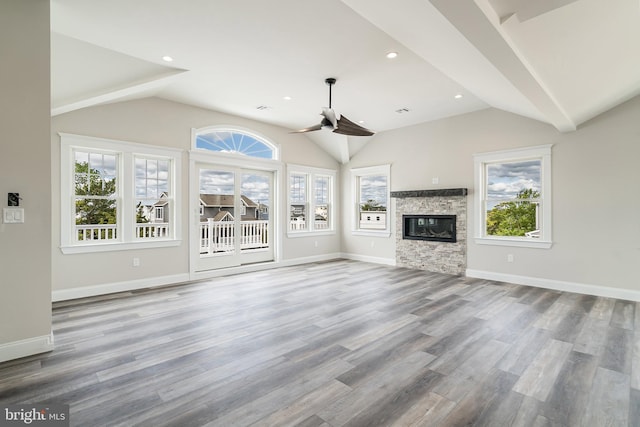 339 11th, Ship Bottom, NJ 08008 - unfurnished living room with lofted ceiling, ceiling fan, wood finished floors, baseboards, and a glass covered fireplace