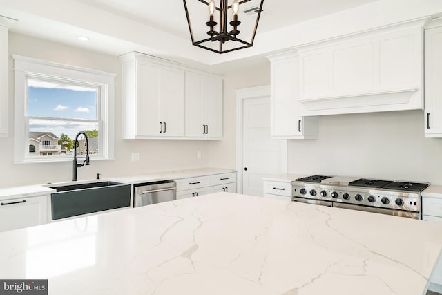 339 11th, Ship Bottom, NJ 08008 - kitchen with a sink, range, dishwasher, a chandelier, and white cabinetry