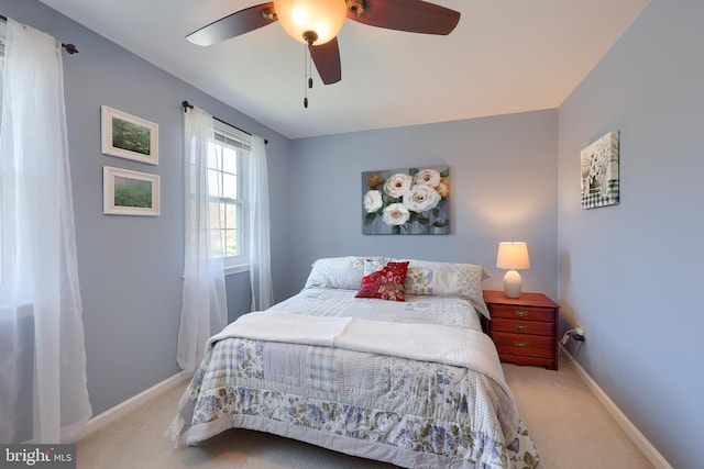 bedroom featuring baseboards, carpet, and a ceiling fan