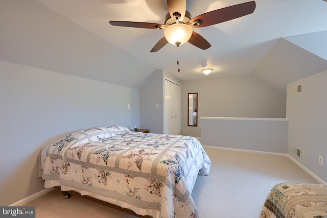 bedroom featuring carpet floors, baseboards, vaulted ceiling, and visible vents