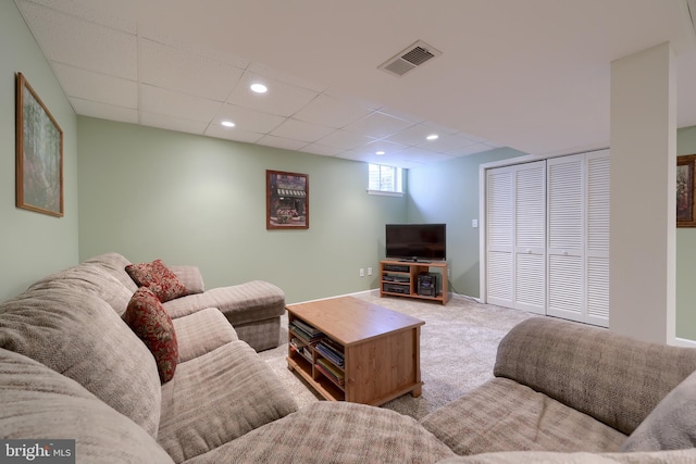 living room with carpet floors, recessed lighting, visible vents, and a paneled ceiling