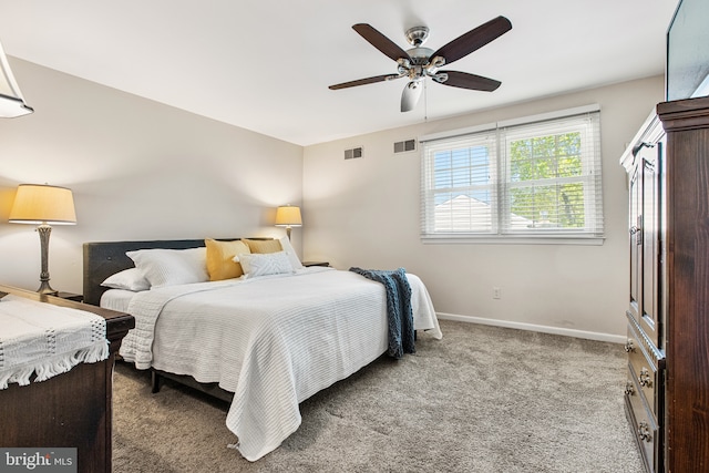 bedroom featuring baseboards, a ceiling fan, carpet flooring, and visible vents