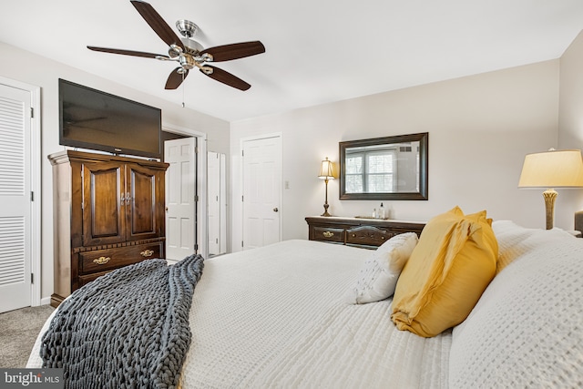 carpeted bedroom featuring ceiling fan