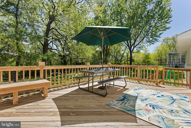 wooden deck with outdoor dining space