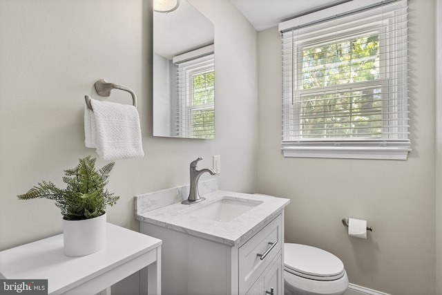 bathroom with vanity and toilet