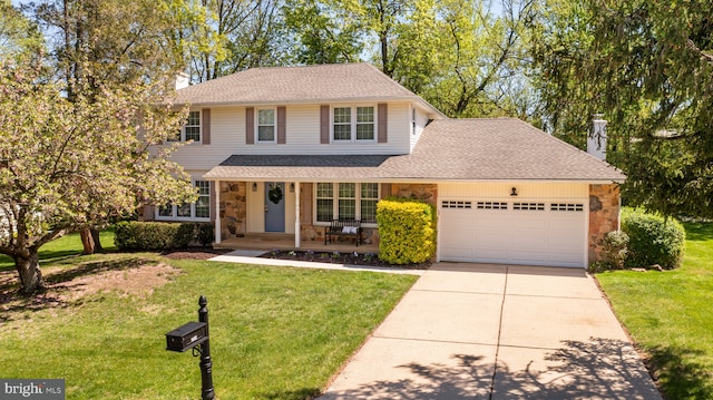 traditional-style home with a garage, a front yard, stone siding, a porch, and driveway
