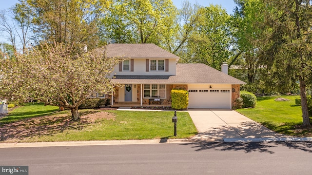 traditional-style home featuring an attached garage, a front lawn, stone siding, covered porch, and driveway