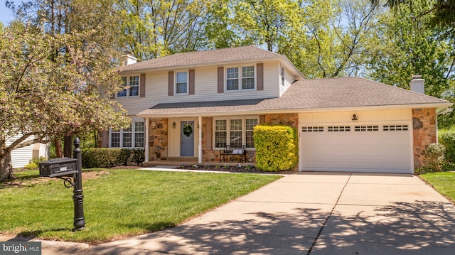 traditional-style house featuring an attached garage, a front lawn, stone siding, a chimney, and concrete driveway