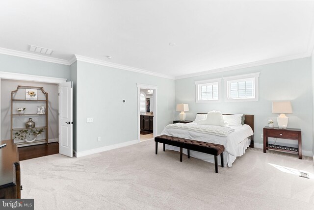 bedroom with crown molding, baseboards, light colored carpet, and visible vents