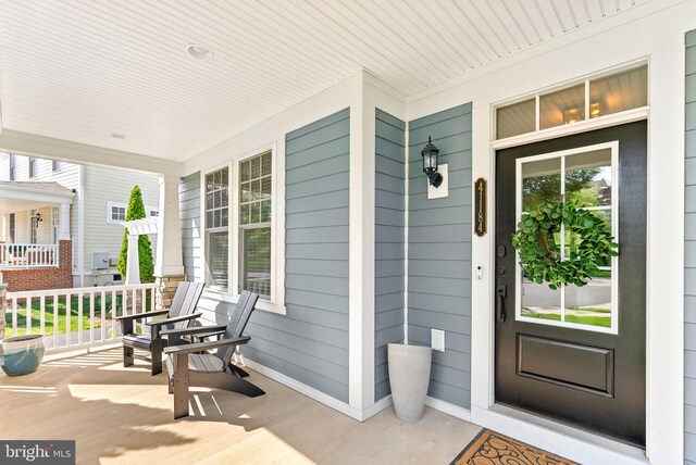 doorway to property with a porch