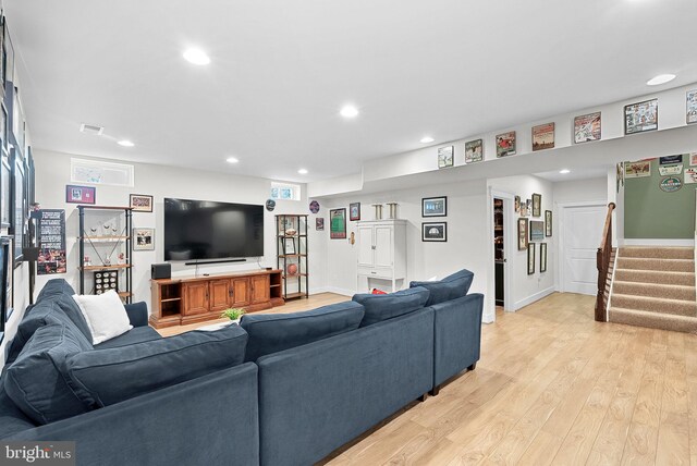 living area with light wood finished floors, stairs, recessed lighting, baseboards, and visible vents