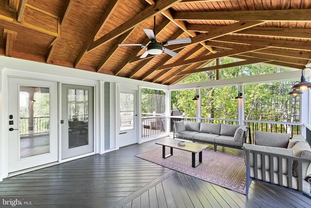 sunroom with ceiling fan, beamed ceiling, and an outdoor hangout area