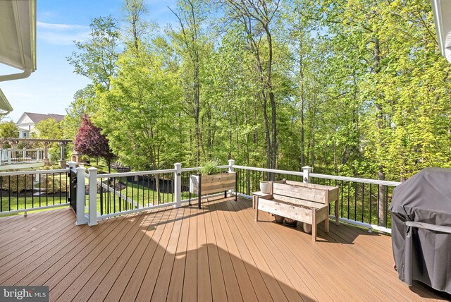wooden terrace with area for grilling