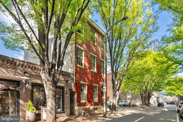 exterior space featuring brick siding