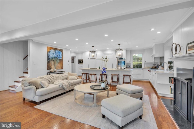 36 E Oak Ave, Moorestown, NJ 08057 - living area with recessed lighting, ornamental molding, stairway, and light wood-style floors