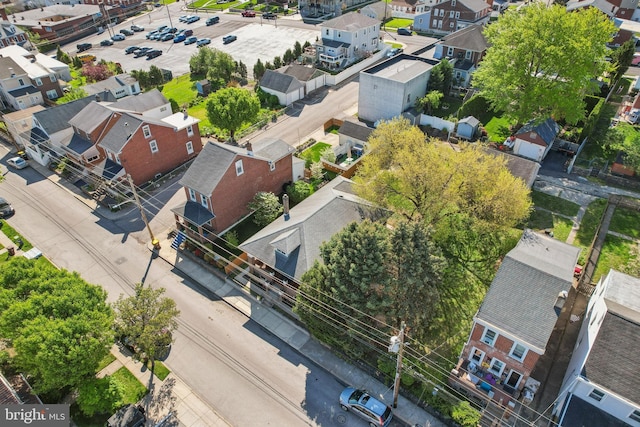 birds eye view of property with a residential view