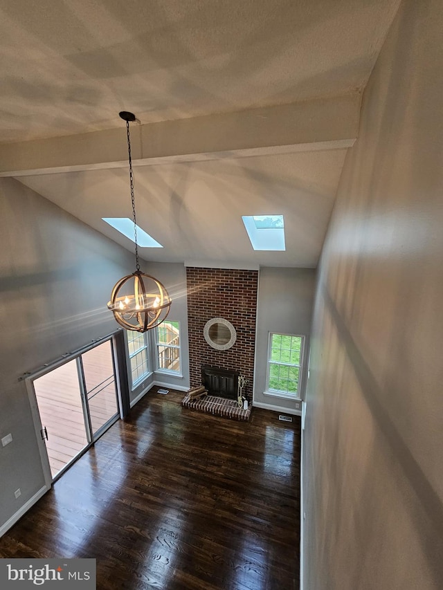 303 Saybrooke View Dr, Gaithersburg, MD 20877 - unfurnished living room featuring a skylight, wood finished floors, a chandelier, and a fireplace