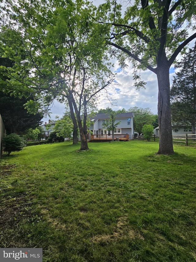 303 Saybrooke View Dr, Gaithersburg, MD 20877 - view of green lawn with a wooden deck