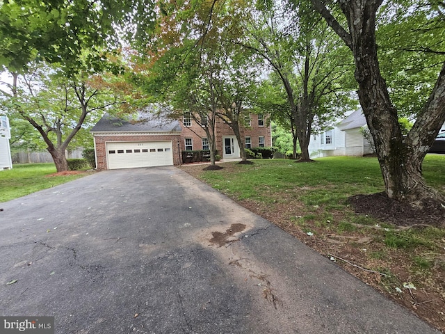 303 Saybrooke View Dr, Gaithersburg, MD 20877 - view of front of property featuring asphalt driveway, a front lawn, brick siding, and an attached garage