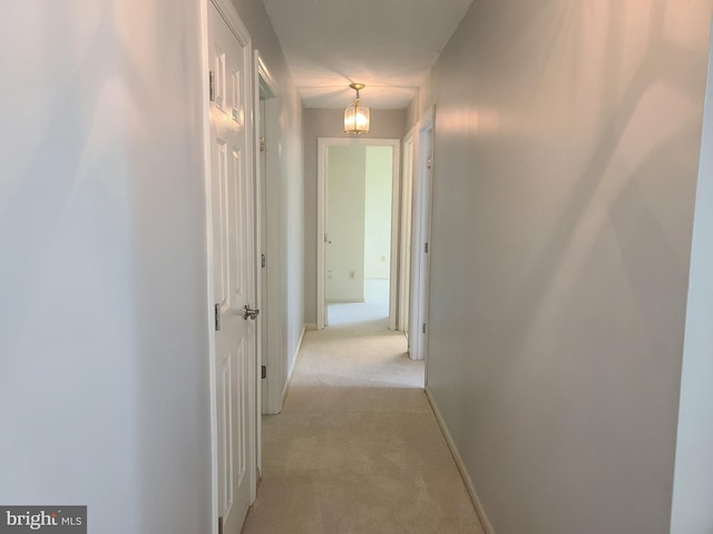 303 Saybrooke View Dr, Gaithersburg, MD 20877 - hallway with light colored carpet and a chandelier