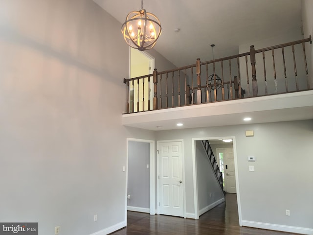 303 Saybrooke View Dr, Gaithersburg, MD 20877 - unfurnished living room featuring high vaulted ceiling, a chandelier, wood finished floors, and stairs