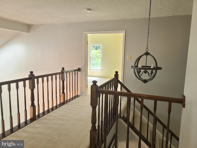 303 Saybrooke View Dr, Gaithersburg, MD 20877 - hall with an upstairs landing, a chandelier, carpet floors, and a textured ceiling