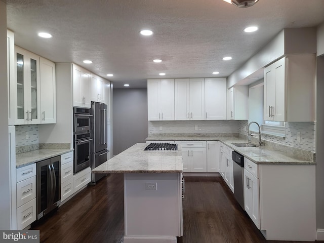 303 Saybrooke View Dr, Gaithersburg, MD 20877 - kitchen featuring beverage cooler, stainless steel appliances, decorative backsplash, dark wood finished floors, and recessed lighting