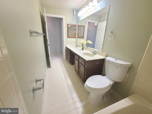 303 Saybrooke View Dr, Gaithersburg, MD 20877 - full bath featuring double vanity, tile patterned flooring, a bath, and a textured ceiling