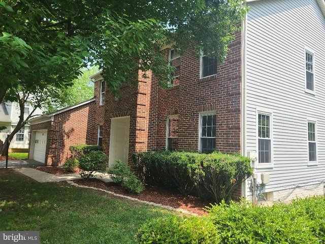 303 Saybrooke View Dr, Gaithersburg, MD 20877 - view of side of property with an attached garage and brick siding