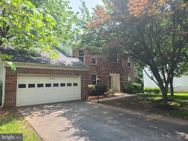 303 Saybrooke View Dr, Gaithersburg, MD 20877 - view of front of home featuring an attached garage, brick siding, driveway, and a shingled roof