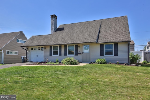 view of front of home featuring fence, a front lawn, a garage, a chimney, and driveway