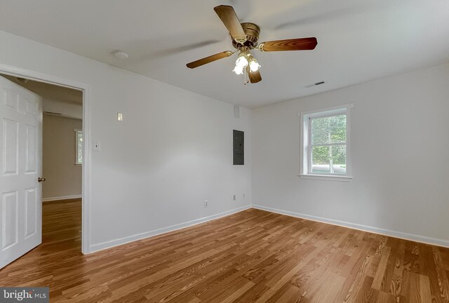 42190 Ridge Rd, Mechanicsville, MD 20659 - empty room featuring baseboards, visible vents, light wood-type flooring, and electric panel