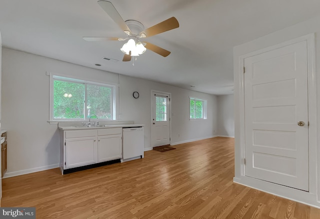 42190 Ridge Rd, Mechanicsville, MD 20659 - kitchen with white cabinets, a sink, light wood-style floors, dishwasher, and visible vents